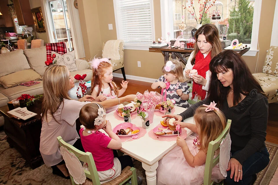 Children at a Valentine's party around a decorated table