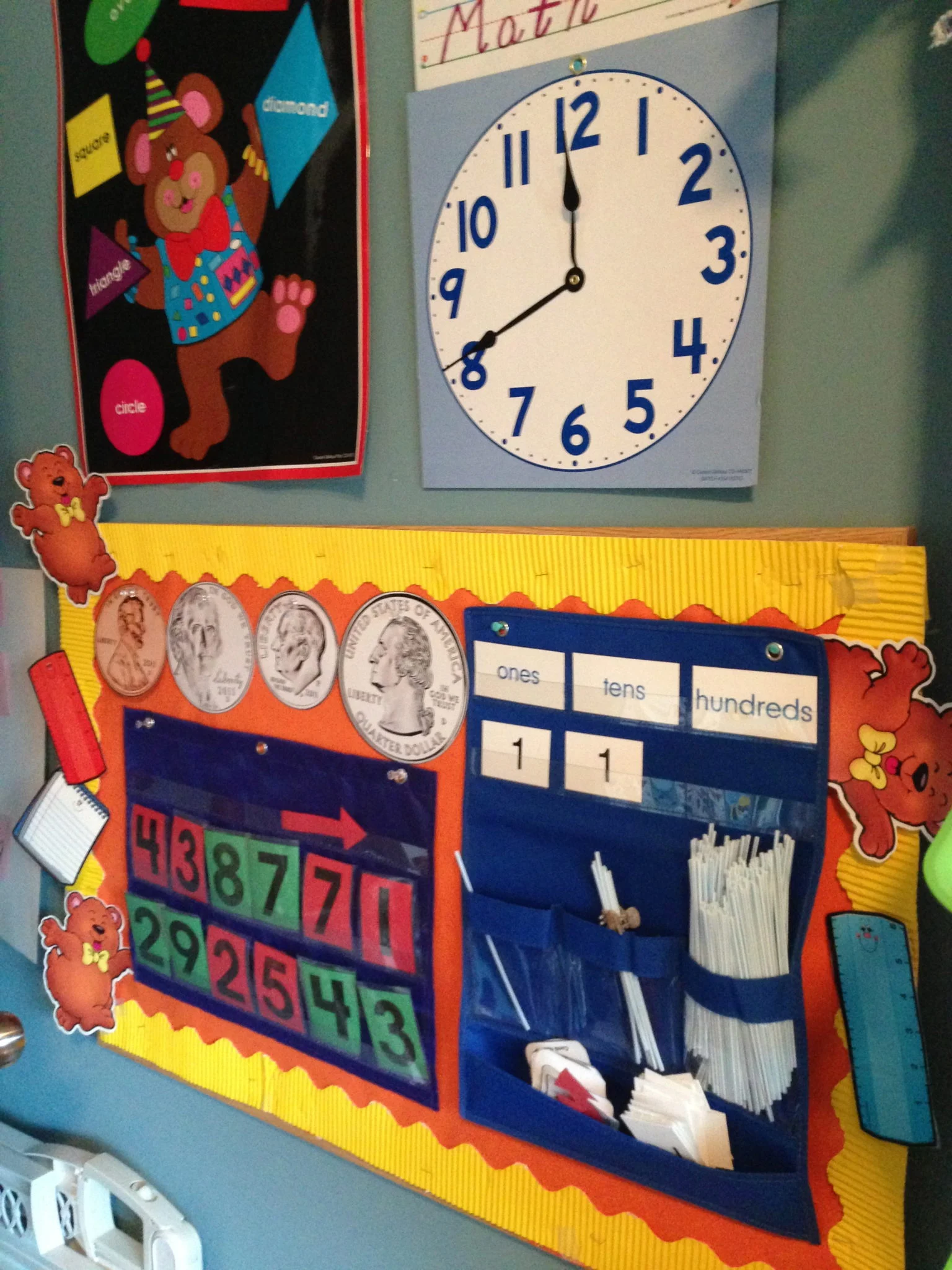 Home-school wall with a calendar, clock and pocket chart