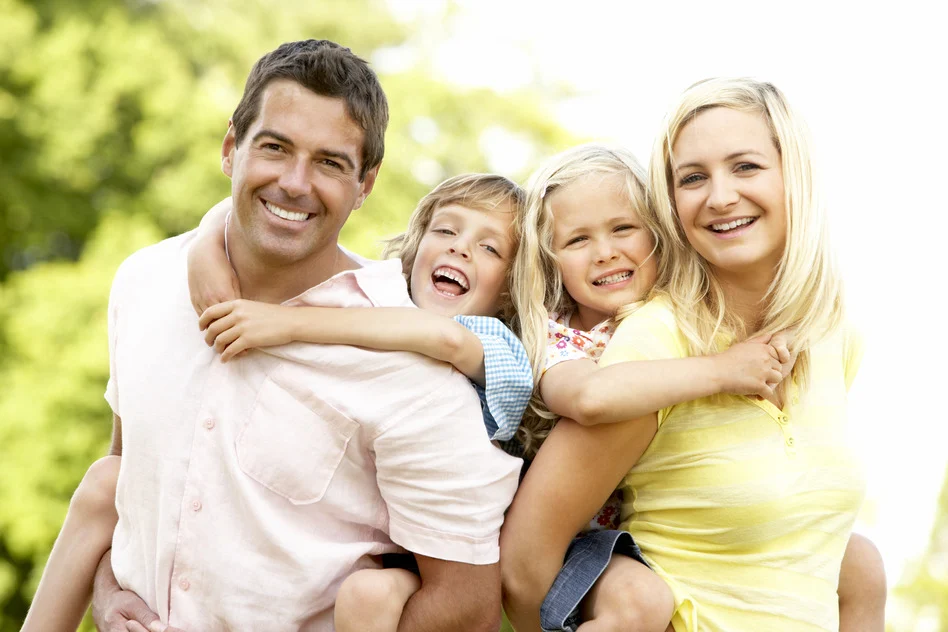 Family of four having fun outdoors