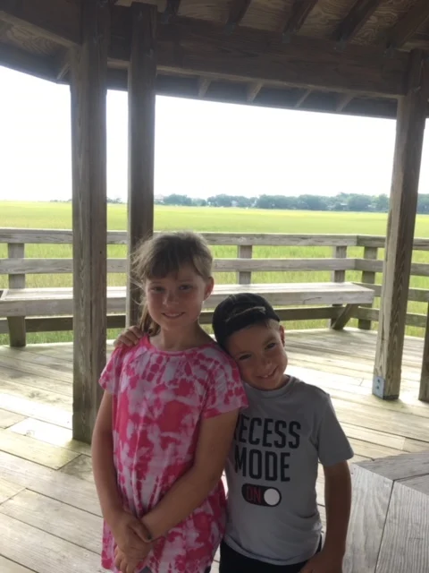 Two children under a wooden pavilion in Hilton Head