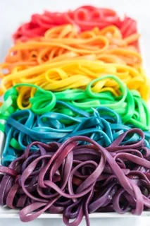 Plate of rainbow-colored spaghetti