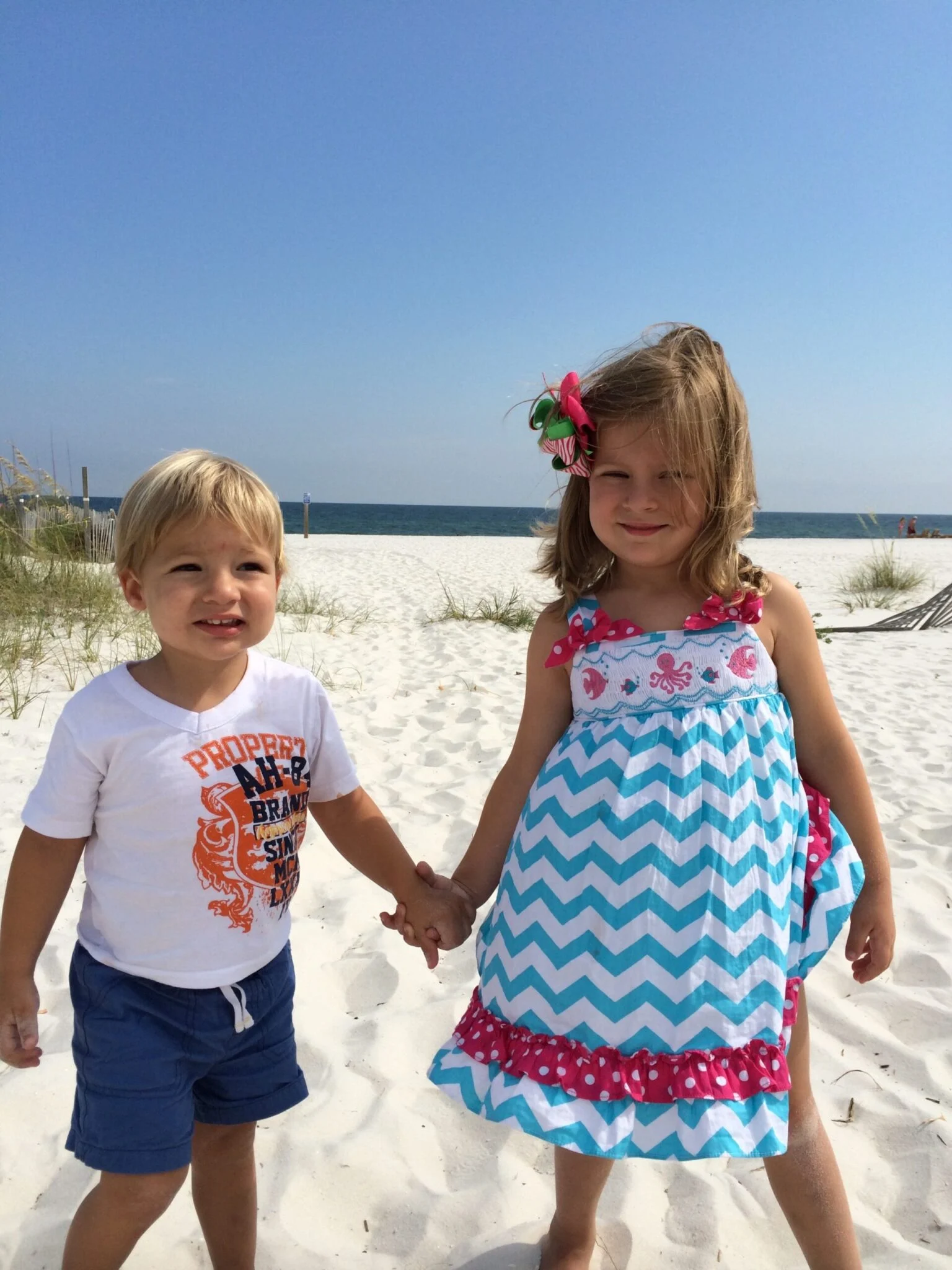 Kids playing happily on a sunny beach in Charleston, SC, highlighting family-friendly summer outdoor activities.