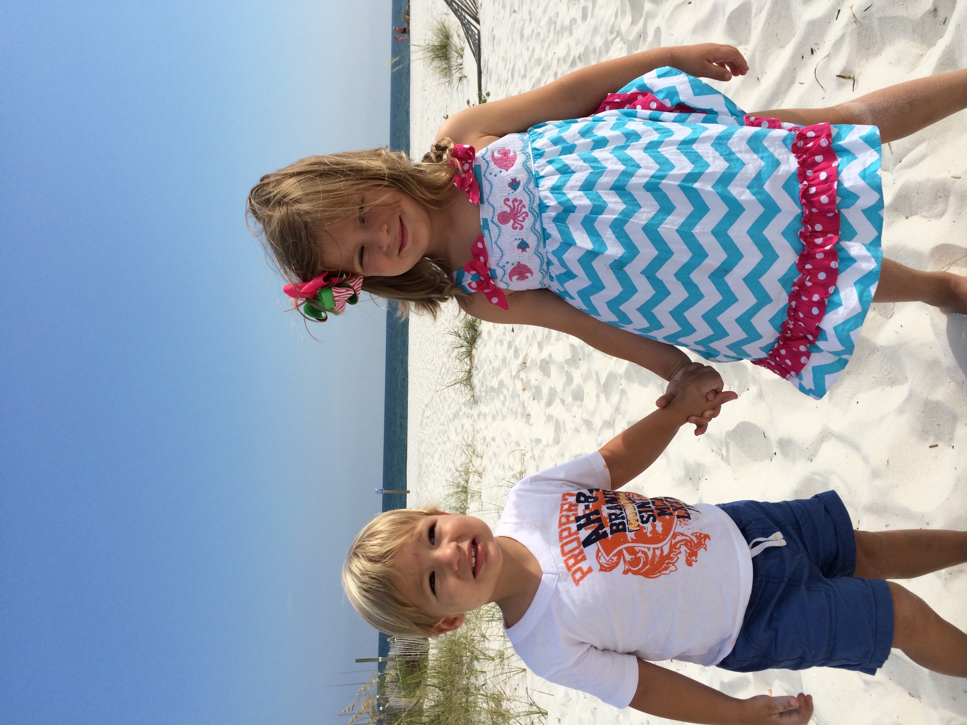 Kids playing happily on a sunny beach in Charleston, SC, highlighting family-friendly summer outdoor activities.