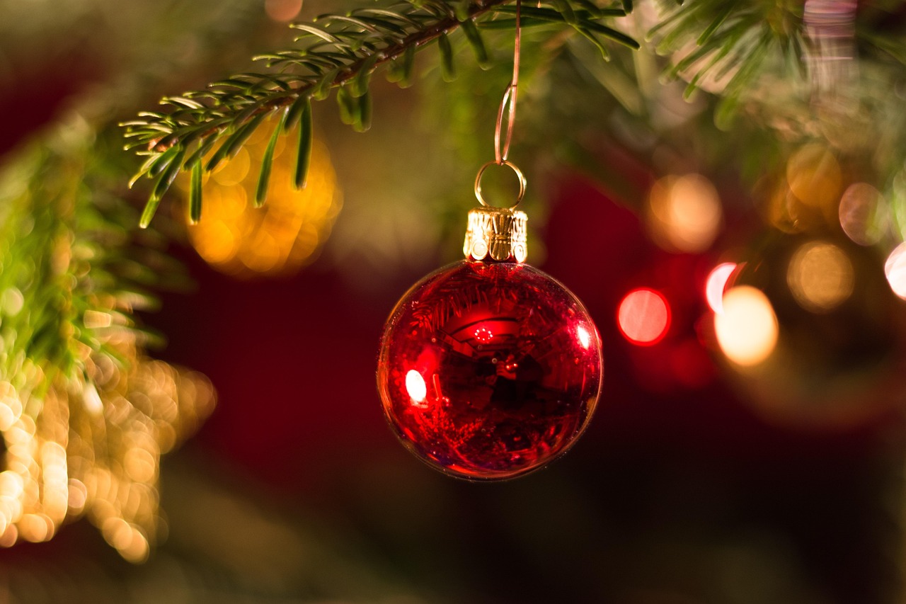 Holiday nanny hiring in Savannah — family decorating a Christmas tree
