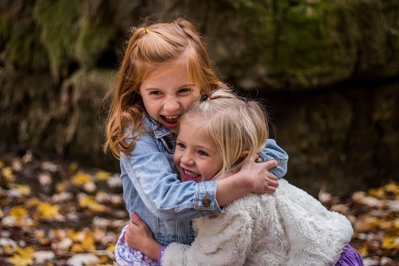 Two young children playing at a park in Savannah, Georgia after school