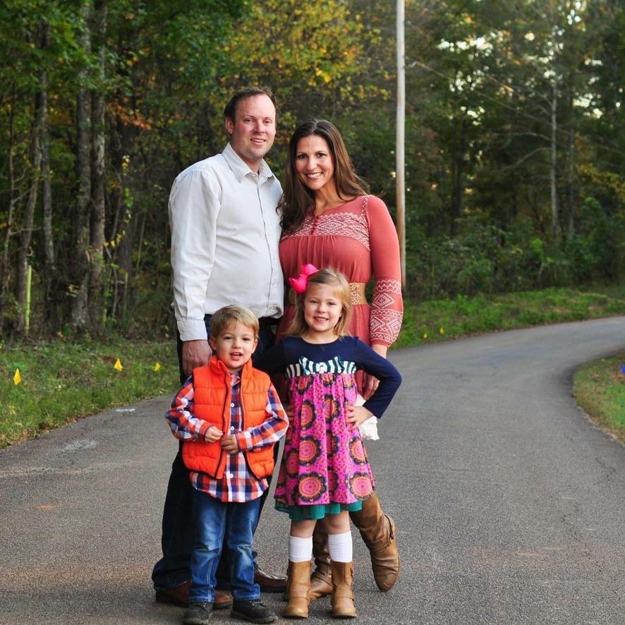 Serra Deville, founder of Georgia’s Dream Nannies, with her husband Don Deville and their two children